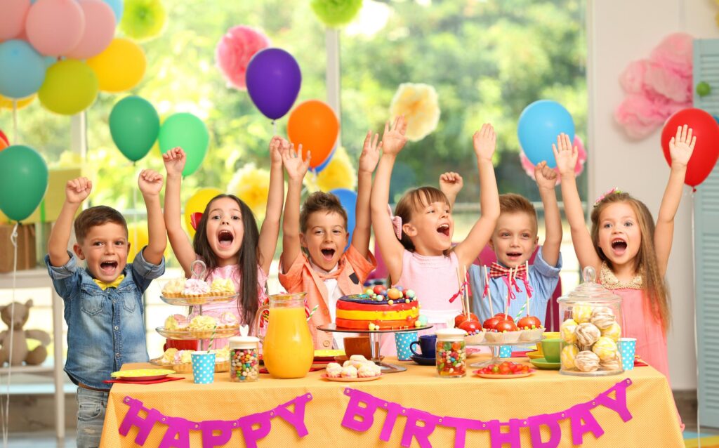 Children and adults enjoying a well-planned birthday party celebration