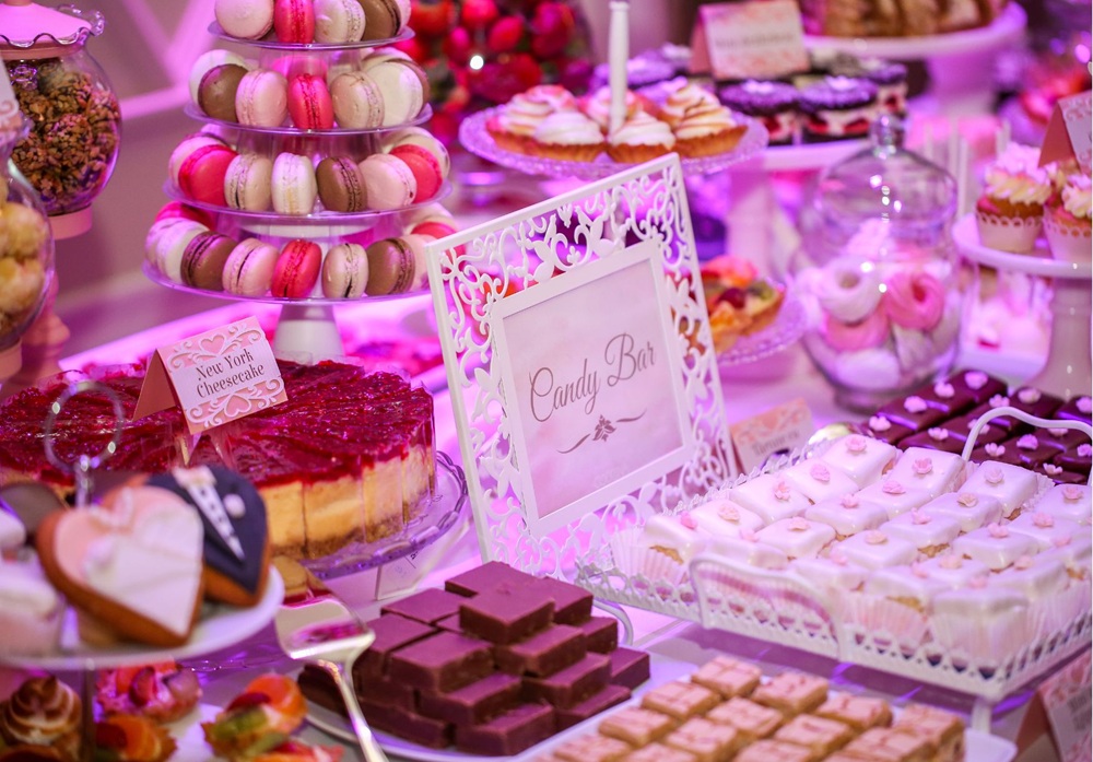 Elegant candy bar with macarons and treats, sweet station to delight children